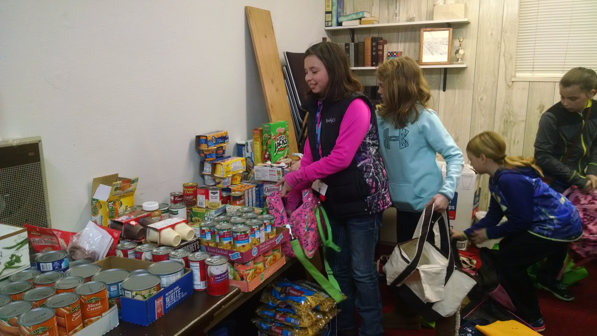  Youth of the church help pack the bags.