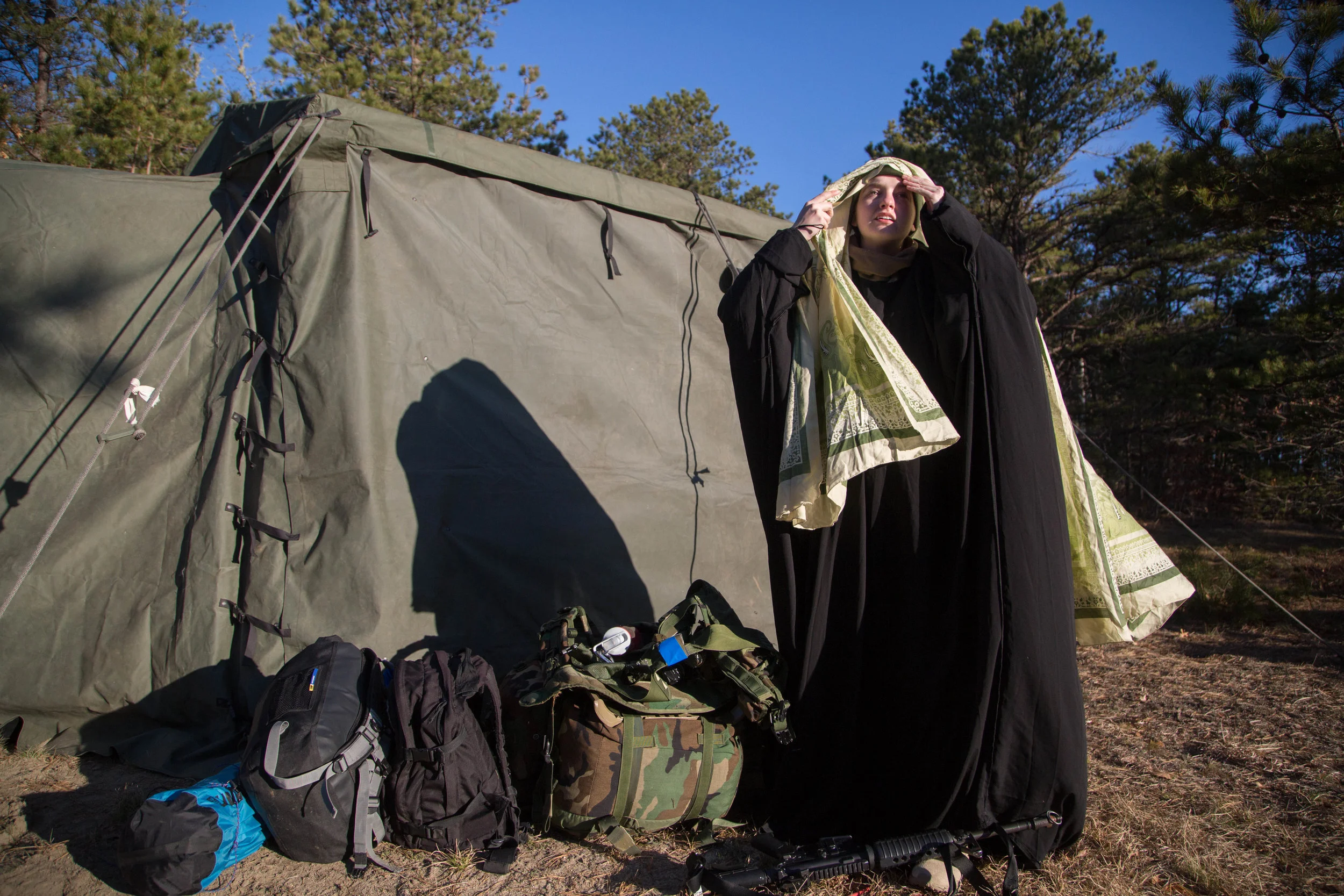 Charles River Battalion cadet Margaret Page prepares for a drill at the Cape Cod Military Base.