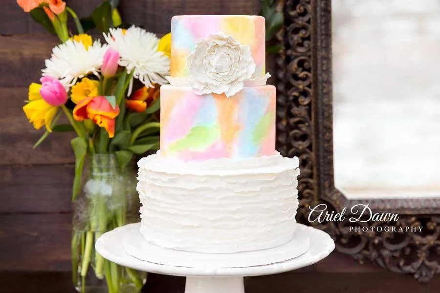 Handpainted watercolor wedding cake with fondant ruffles
