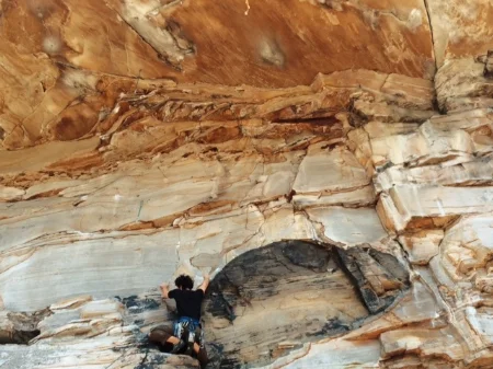 Paul Brenner heading to the roof on Puppy Chow (5.12c)