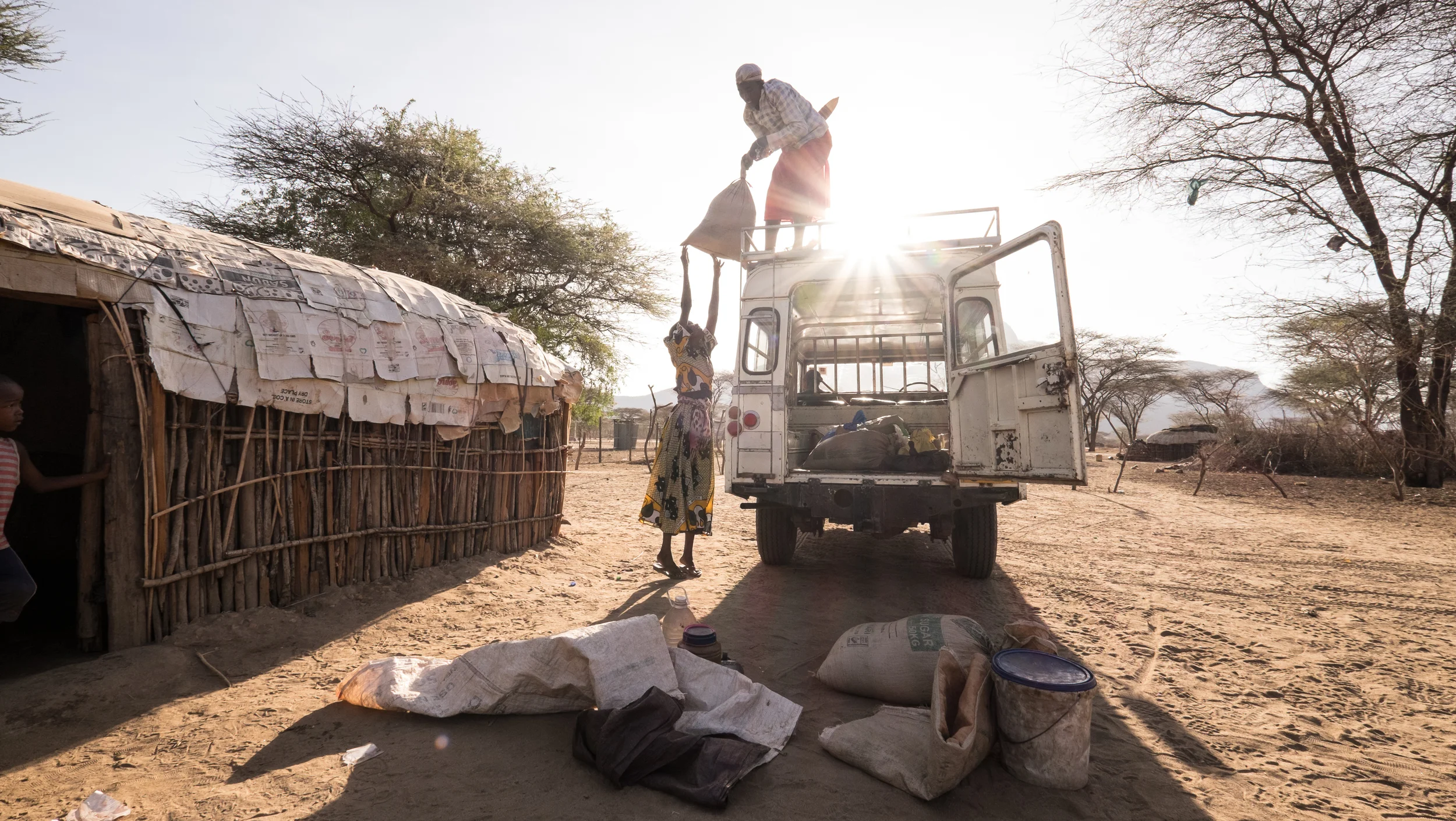 Unloading Supplies at Ilaut Market credit David duChemin for BOMA.jpg