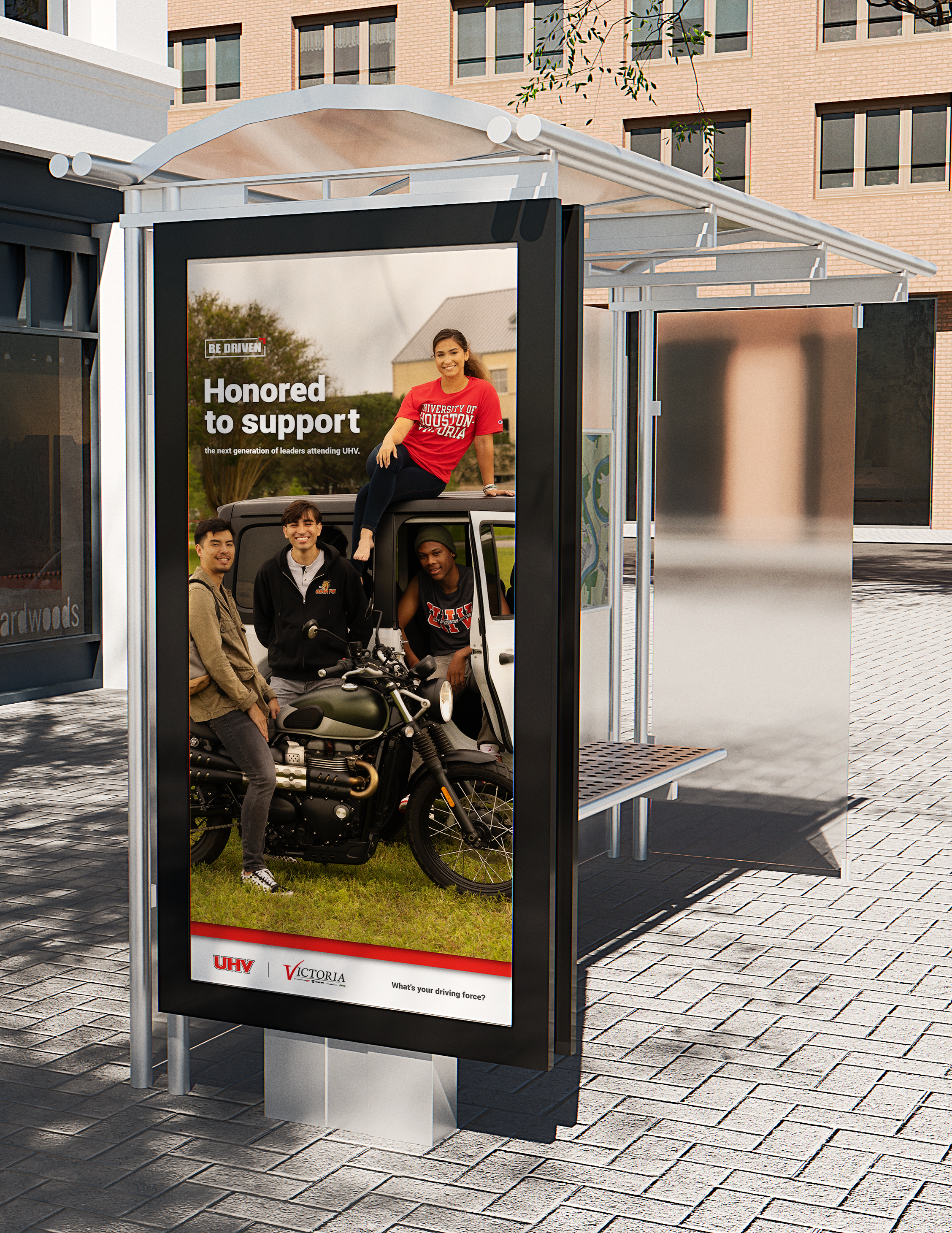 "UHV student recruitment bus stop poster by Larzell Cowan of Fresh Fox Design Studio featuring University of Houston-Victoria students with a Jeep the tagline 'Be Driven. Honored to support the next generation of leaders attending UHV.'"