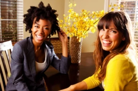 2 young women at table_000011444943.jpg