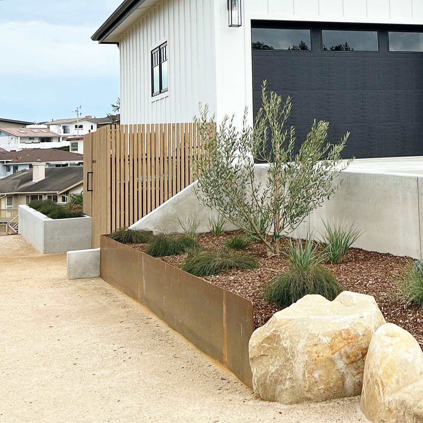 The intersections of formed and welded, welded and raw. A combination of materials to soften the expansive  concrete driveway and serve as a more organic transition to the open space that surrounds it. 
.
.
.
#ncdesigns #landscapedesign #landscapearc