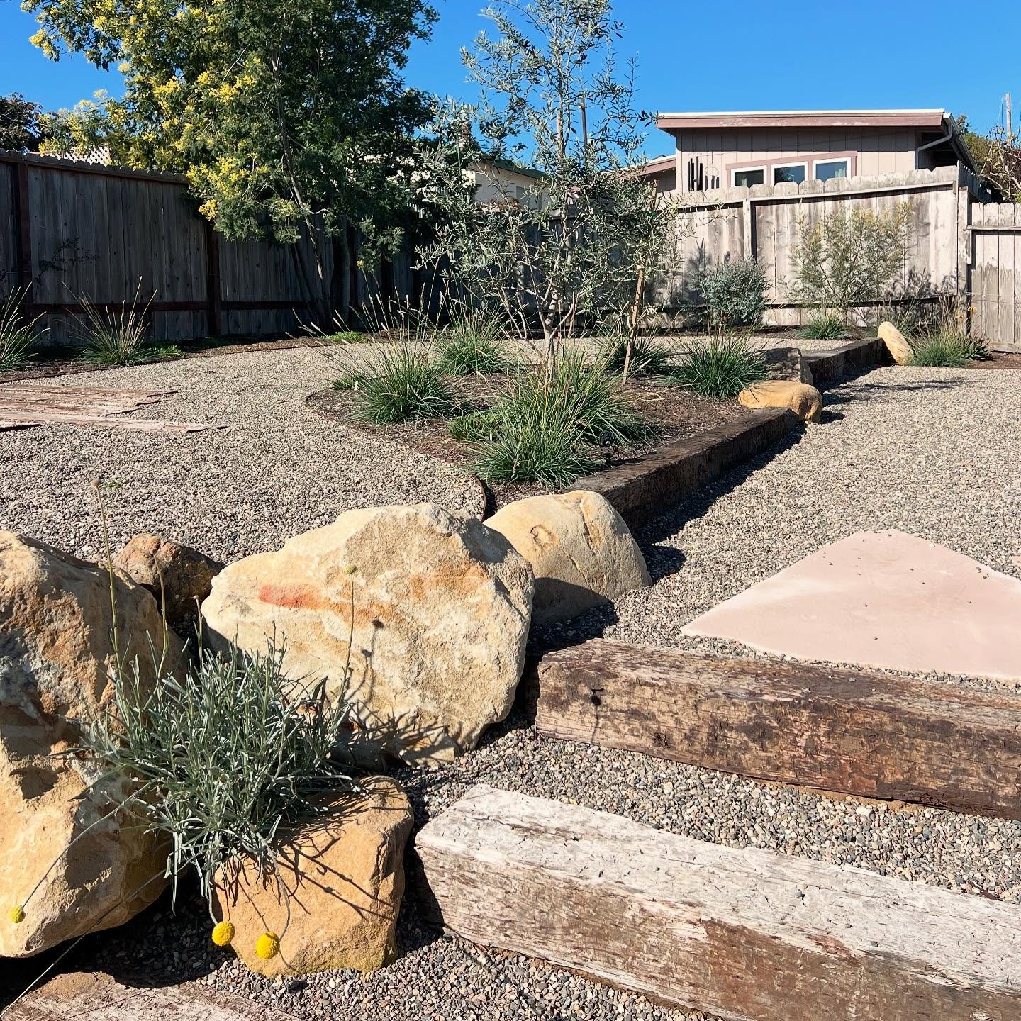 Gentle terracing with organic materials to create a low-key, Los Osos landscape. We wanted a space the clients could relax into that mimicked local walking trails and celebrated a more natural approach to design. From an unusable sandy slope to a fle