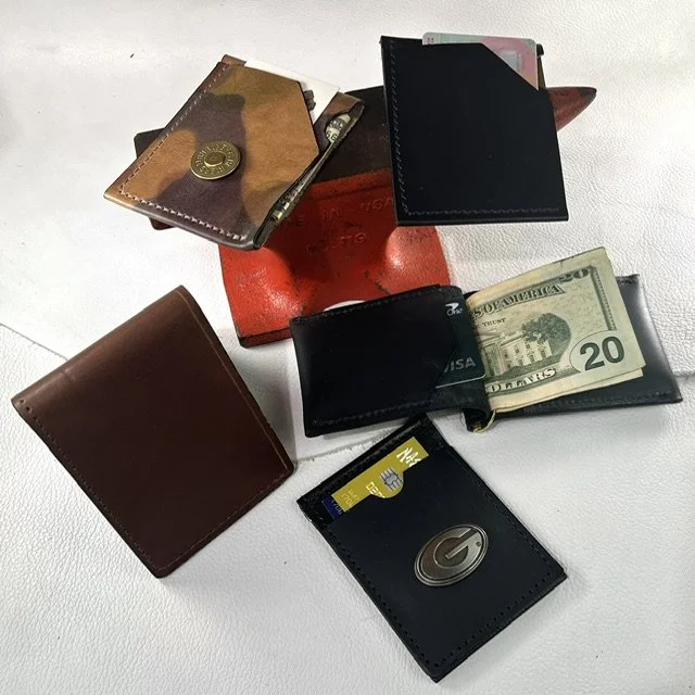 assorted men's leather wallets