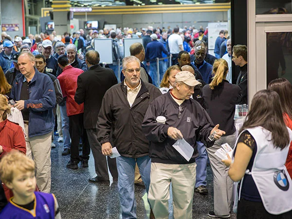 Attendees grab their door takeaway courtesy of BMW Championship, presenting sponsor of our 30th annual show