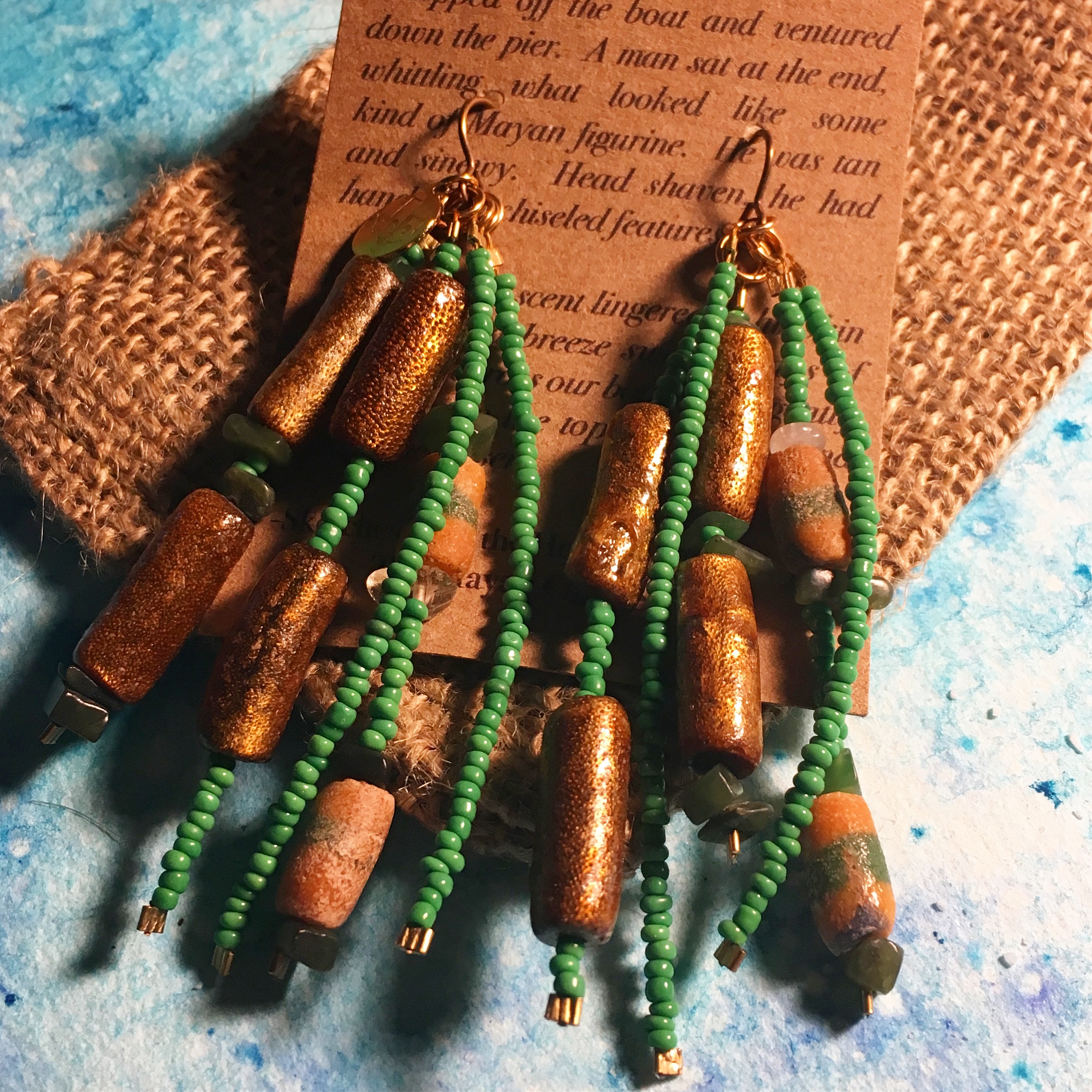 Tribal Vibrations: From the Mayan Connection "Time stood still as we sat before the waterfall. The water pounded against the rocky mountainside. Not a whisper was spoken as the deafening sounds of the water crashed into the rippling pool that rested at it’s feet." Coral, Jade, Sandcast, Glass Beads, Brass Click Here for More
