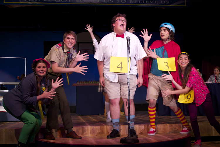 The competitors even break out their jazz hands for Barfee's solo about his unique approach to spelling.