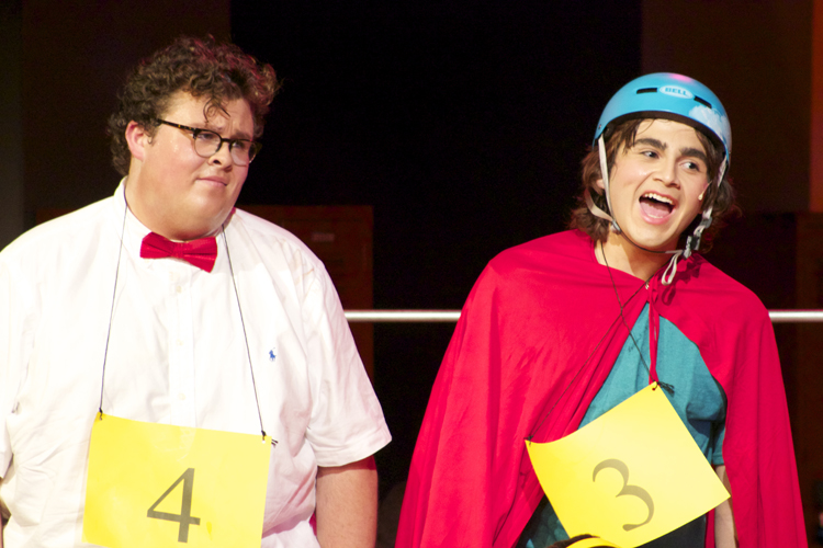 Barfee and Coneybear help sing a competitor offstage.