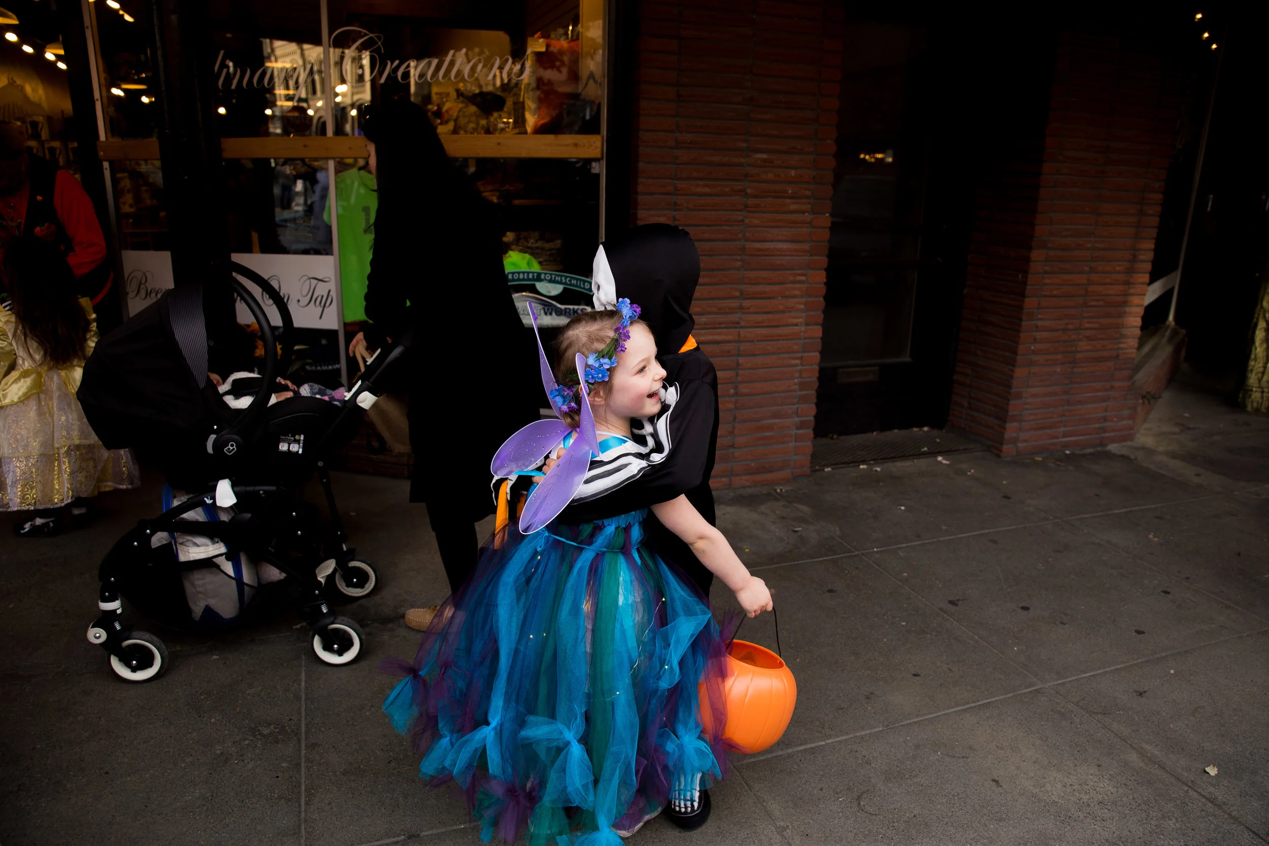 A fairy and skeleton share a hug!