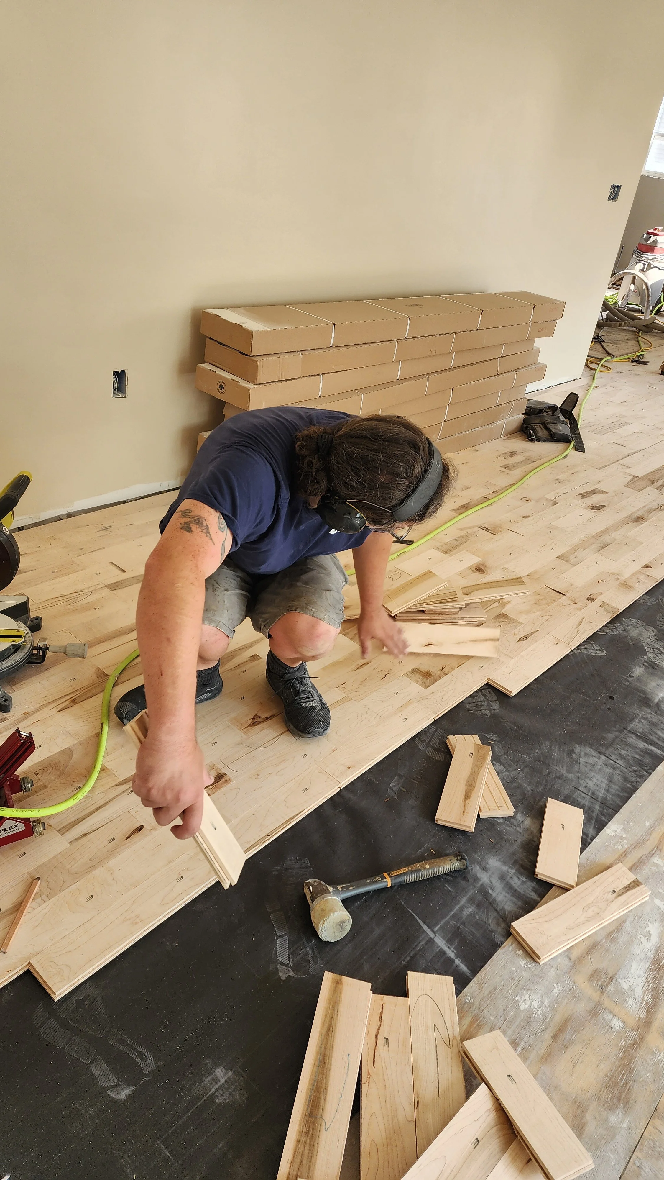 Kevin installing floor in home in Beaver Dam