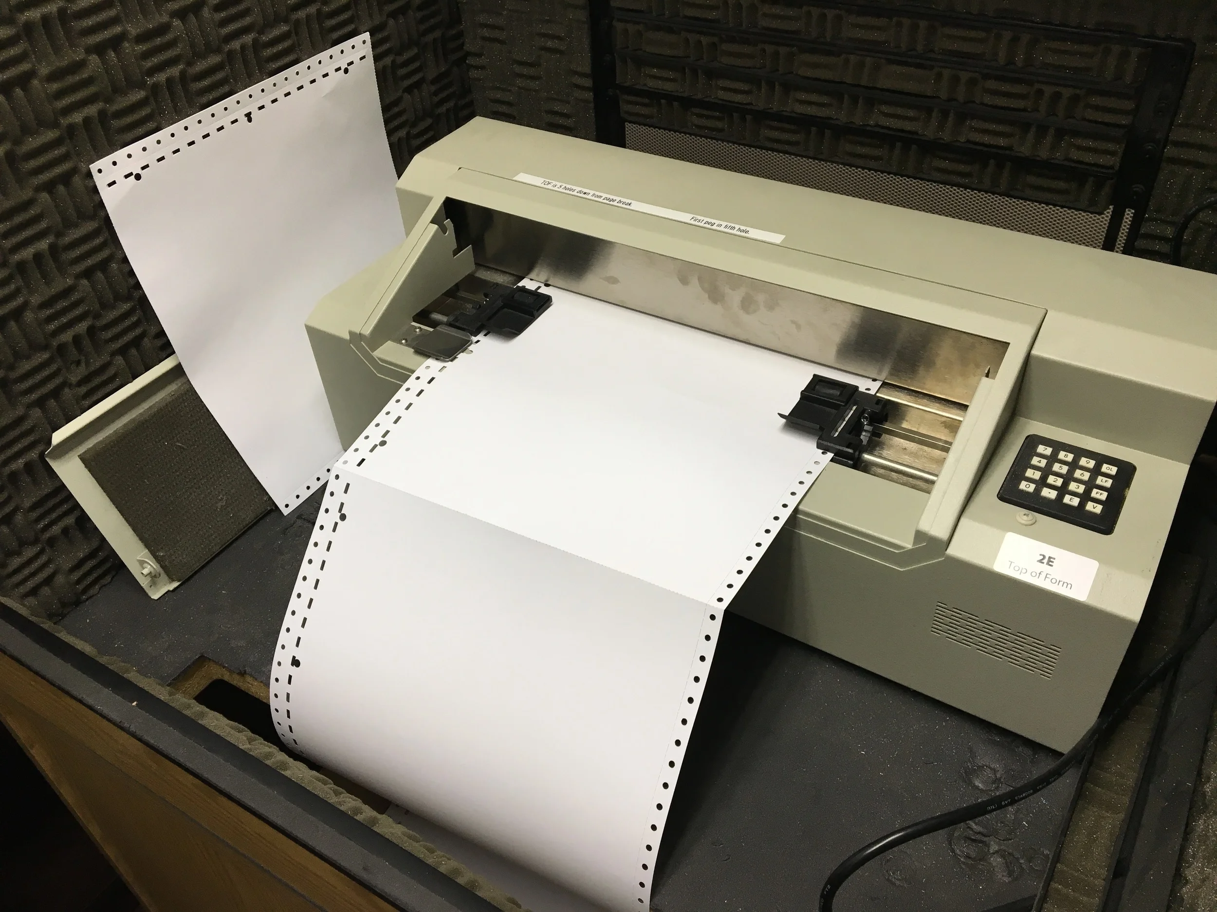 Braille labels being printed from Library for the Blind and Physically Handicapped