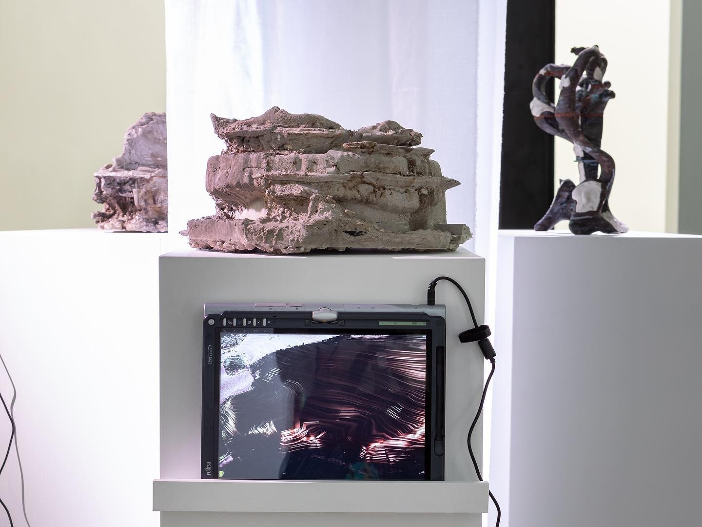 &ldquo;Long Story Short&rdquo; [2022]
Concrete cast in PLA 3D print, poured bismuth, folding laptop with .mp4 video (7:08)
The video attached to this sculpture depicts a simulation of bismuth metal being poured onto the 3D model of the sculpture, a p