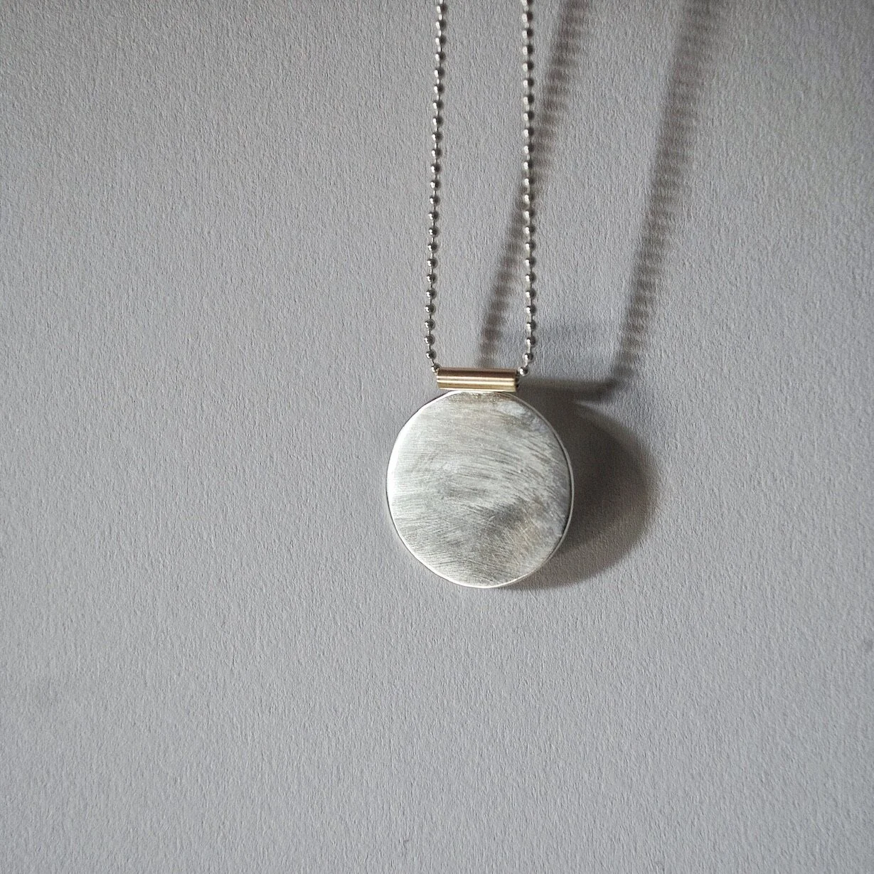 moondisc with gold bail.JPG