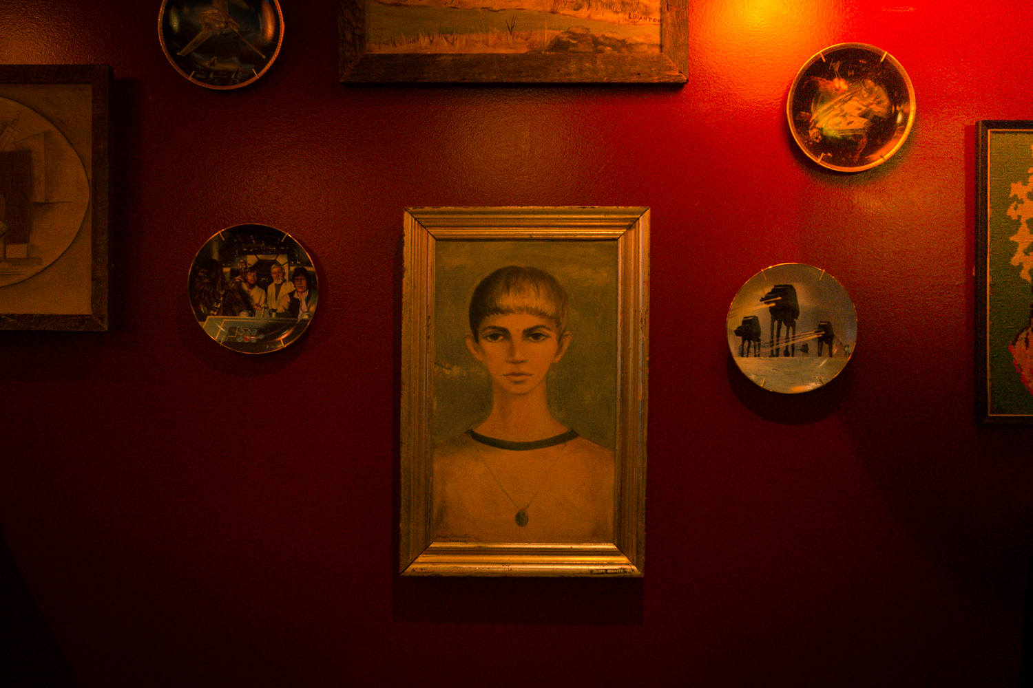 Interior Wall Featuring Paintings and Decorative Plates.jpg