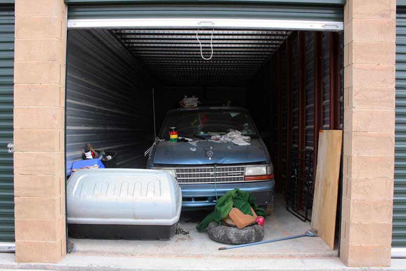 One unit I encountered on the outskirts of Santa Fe, NM contained an old Chrysler Minivan. It looked like it hadn't been driven in years. When I entered further, I saw that the unit had been repurposed into a transitional living space. 