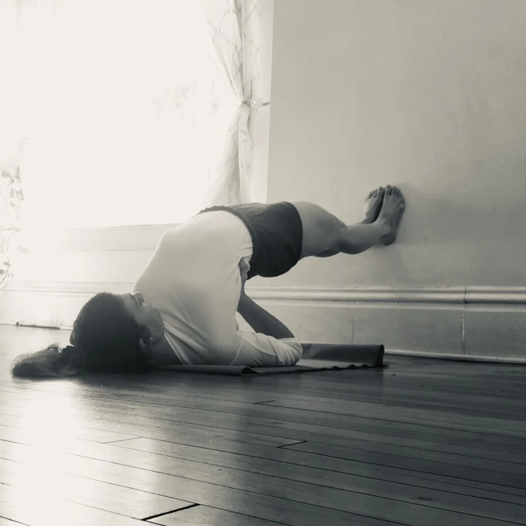Setu Bandha Sarvangasana with wall support