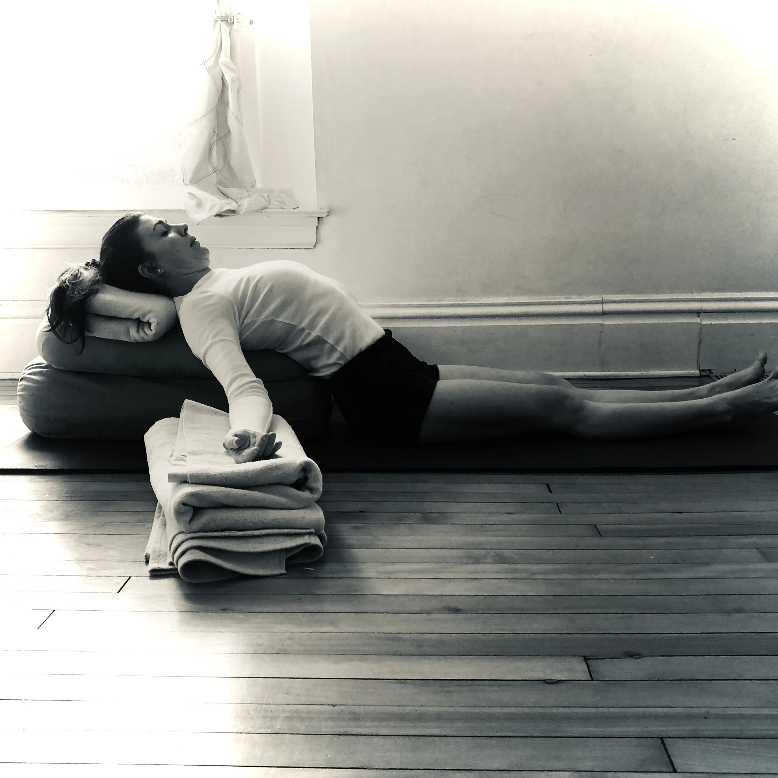 Savasana with high support, arms elevated