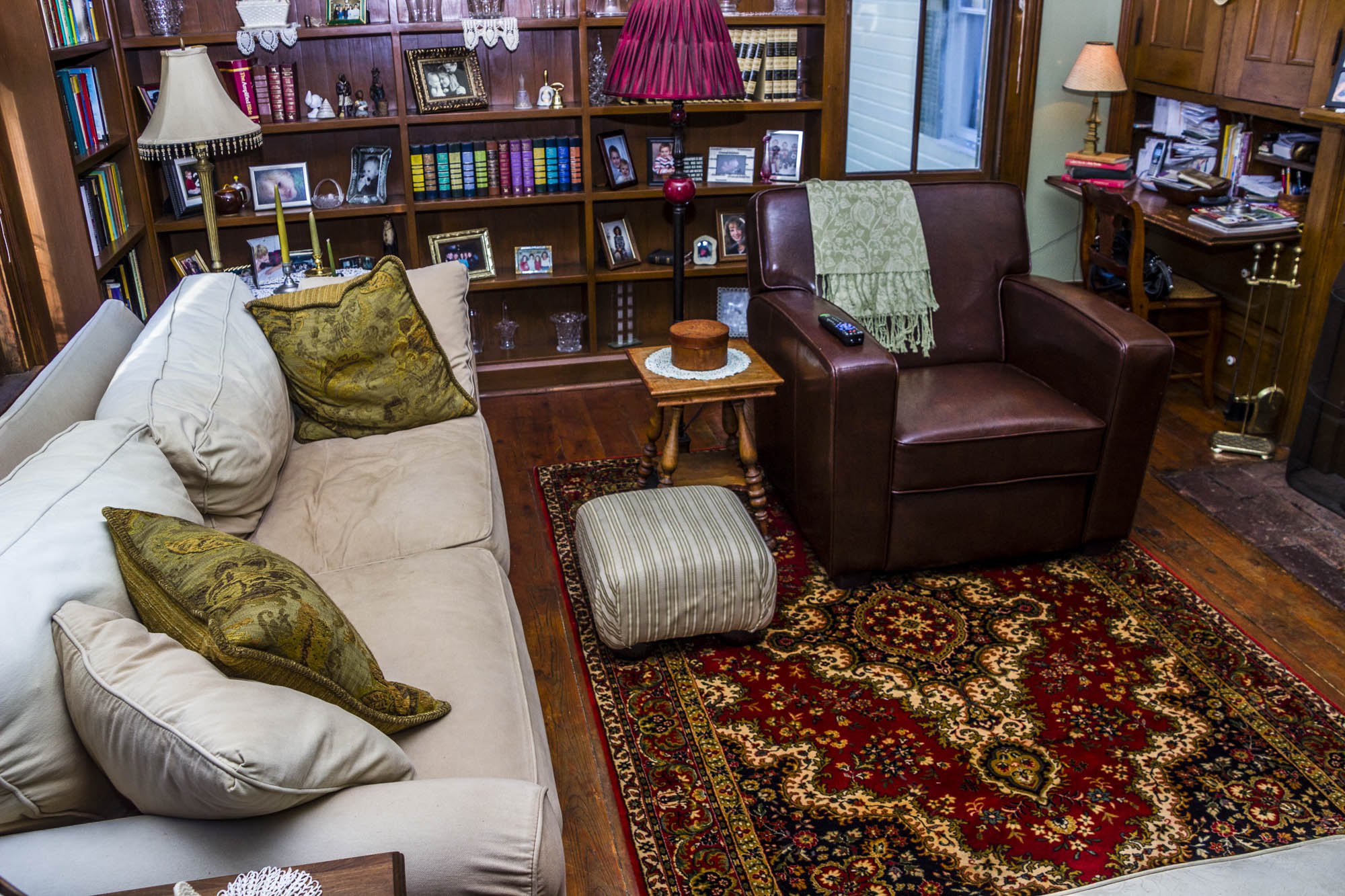 Downstairs sitting room. TV, bookshelves, lots of comfort.