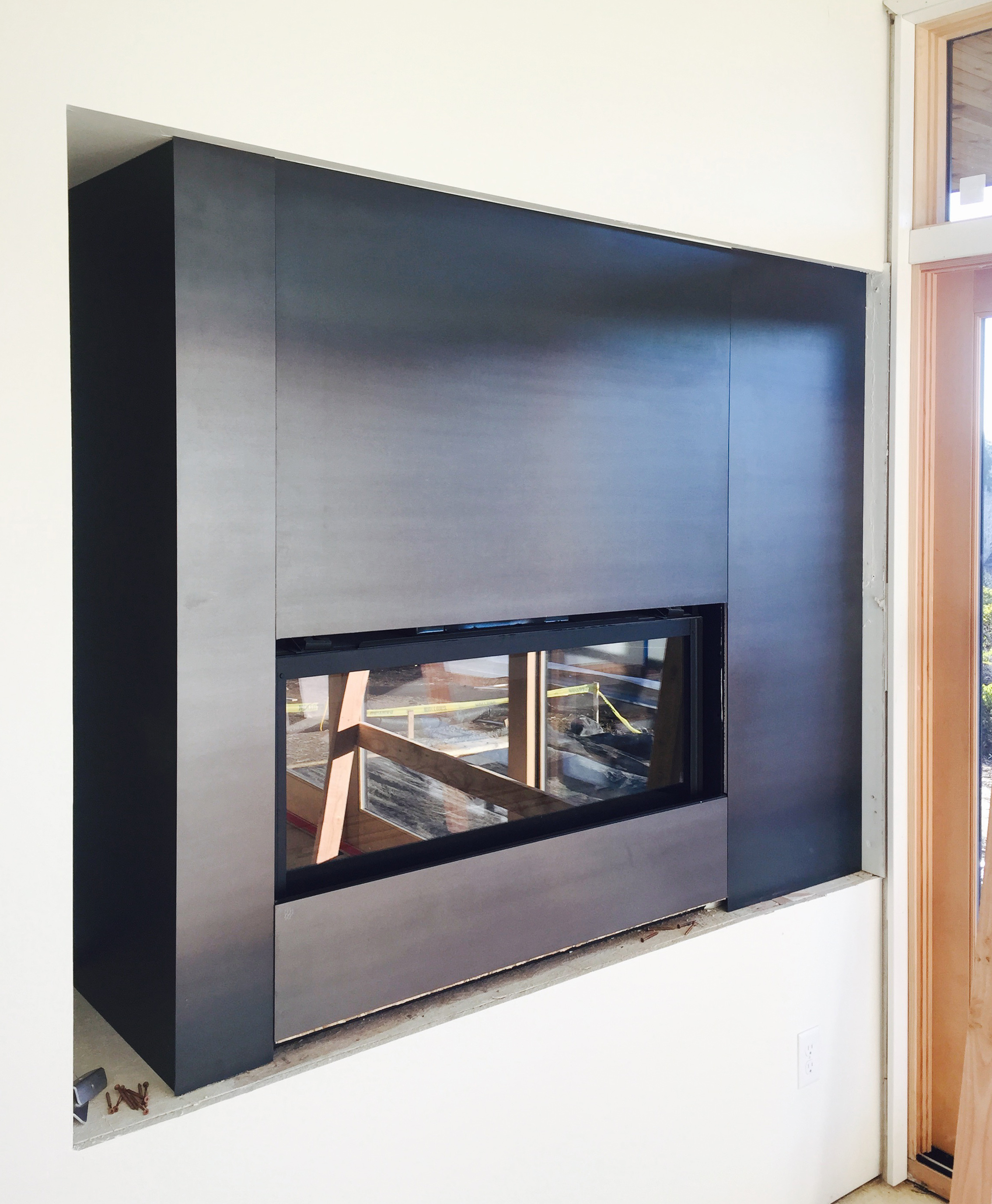 Lot 7 - Steel-wrapped gas fireplace