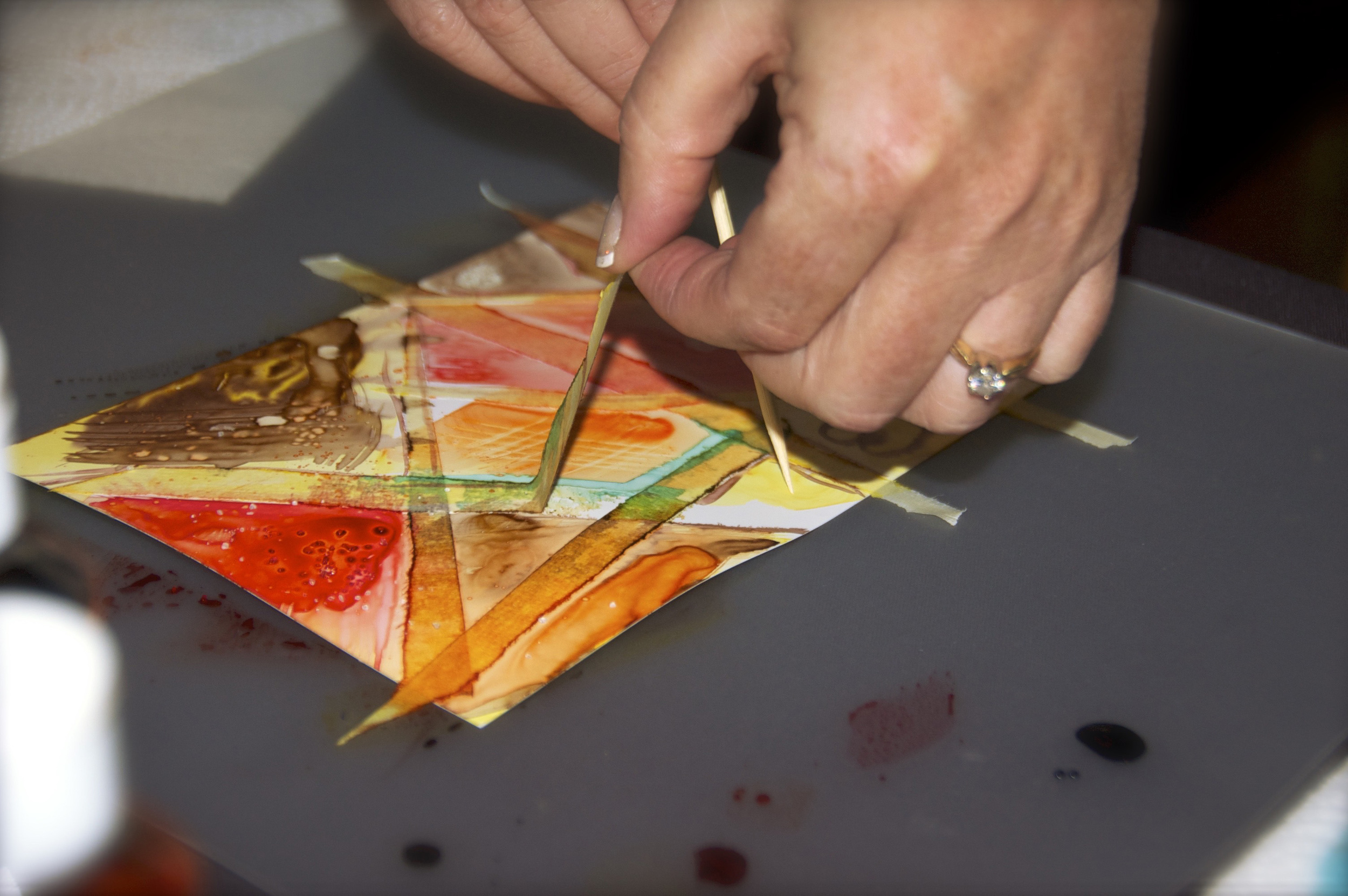 Removing tape to reveal negative space.