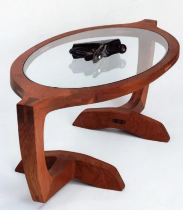 handmade hardwood cherry sculptural coffee table with glass inlay