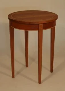 handmade hardwood cherry round side table with maple inlay on top, legs, and bottom of aprons