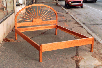 handmade hardwood cherry bed with radial spindle headboard