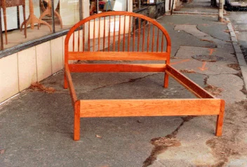 handmade hardwood cherry bed with vertical spindle headboard