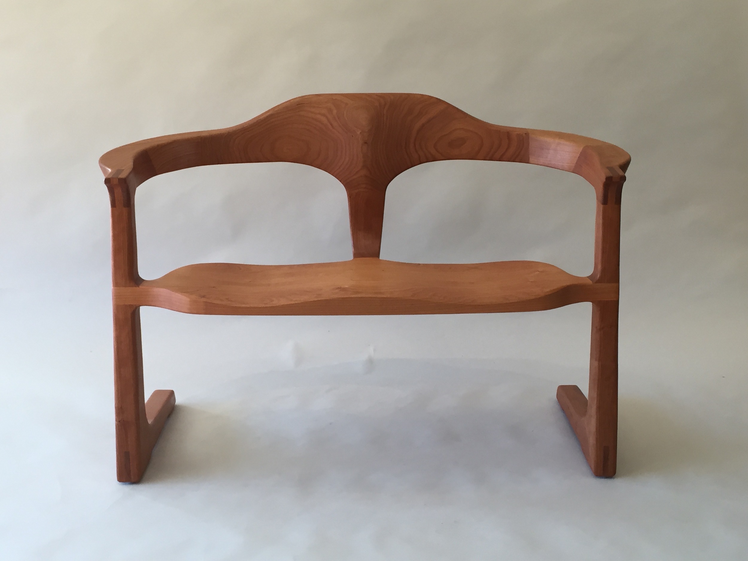 sculptural handmade hardwood cherry settee