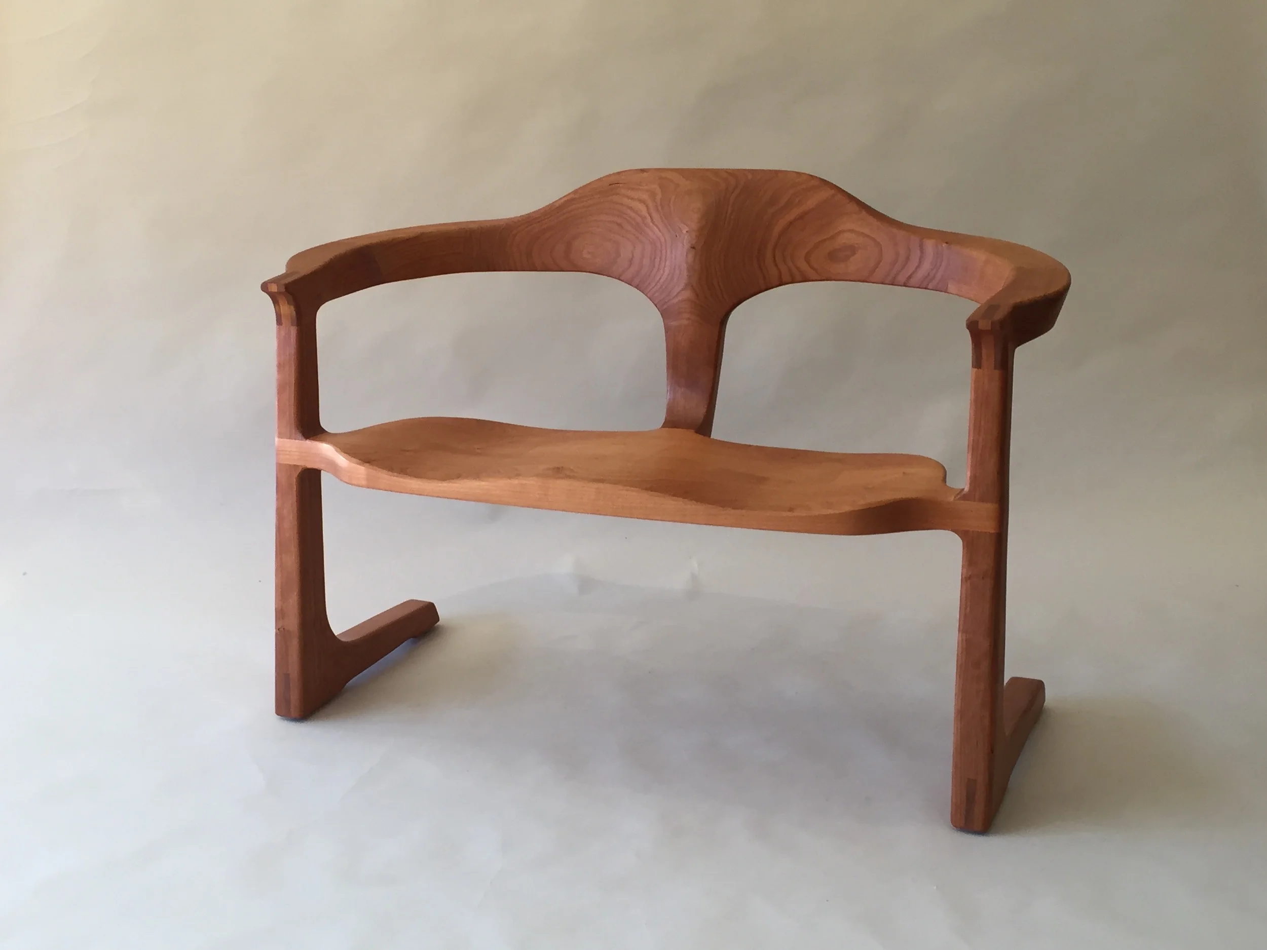 sculptural handmade hardwood cherry settee