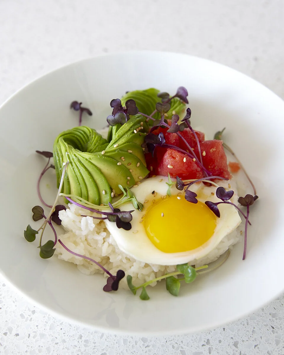Slted Pollock Roe avocado + salted pollock roe + egg over ricet-square in the kitchen