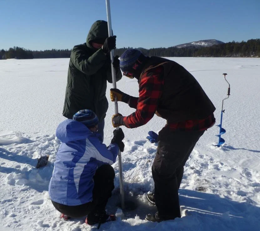 The researchers drilled through snow and ice to extract a sediment core from Lower St. Regis Lake in the Adirondack Mountains of New York State. (Image by Dr. Curt Stager)
