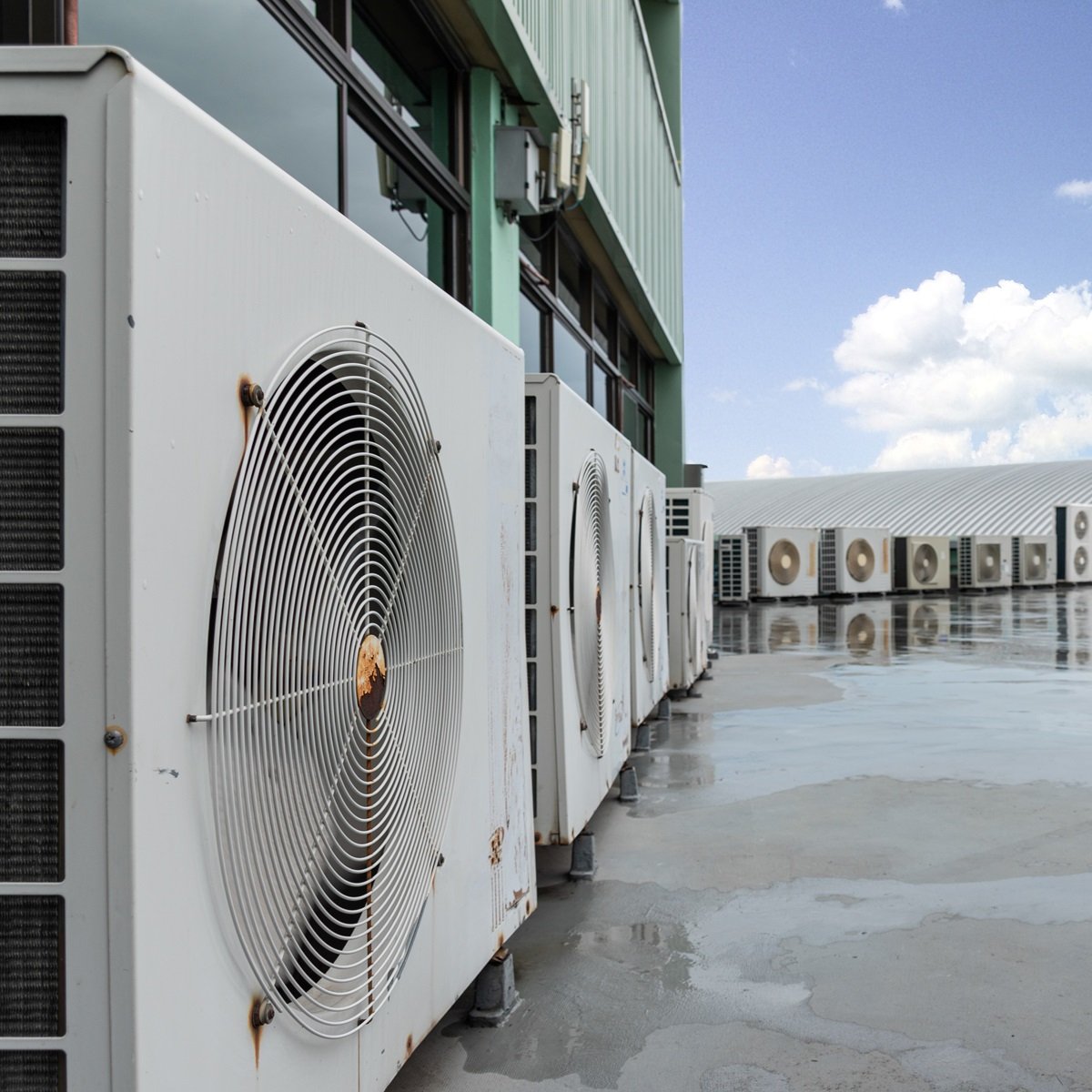 Air compressor on rooftop Bay Air Commercial Air Conditioning.jpg