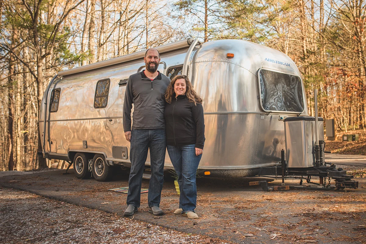 The Watsons in front of their 1999 Airstream!