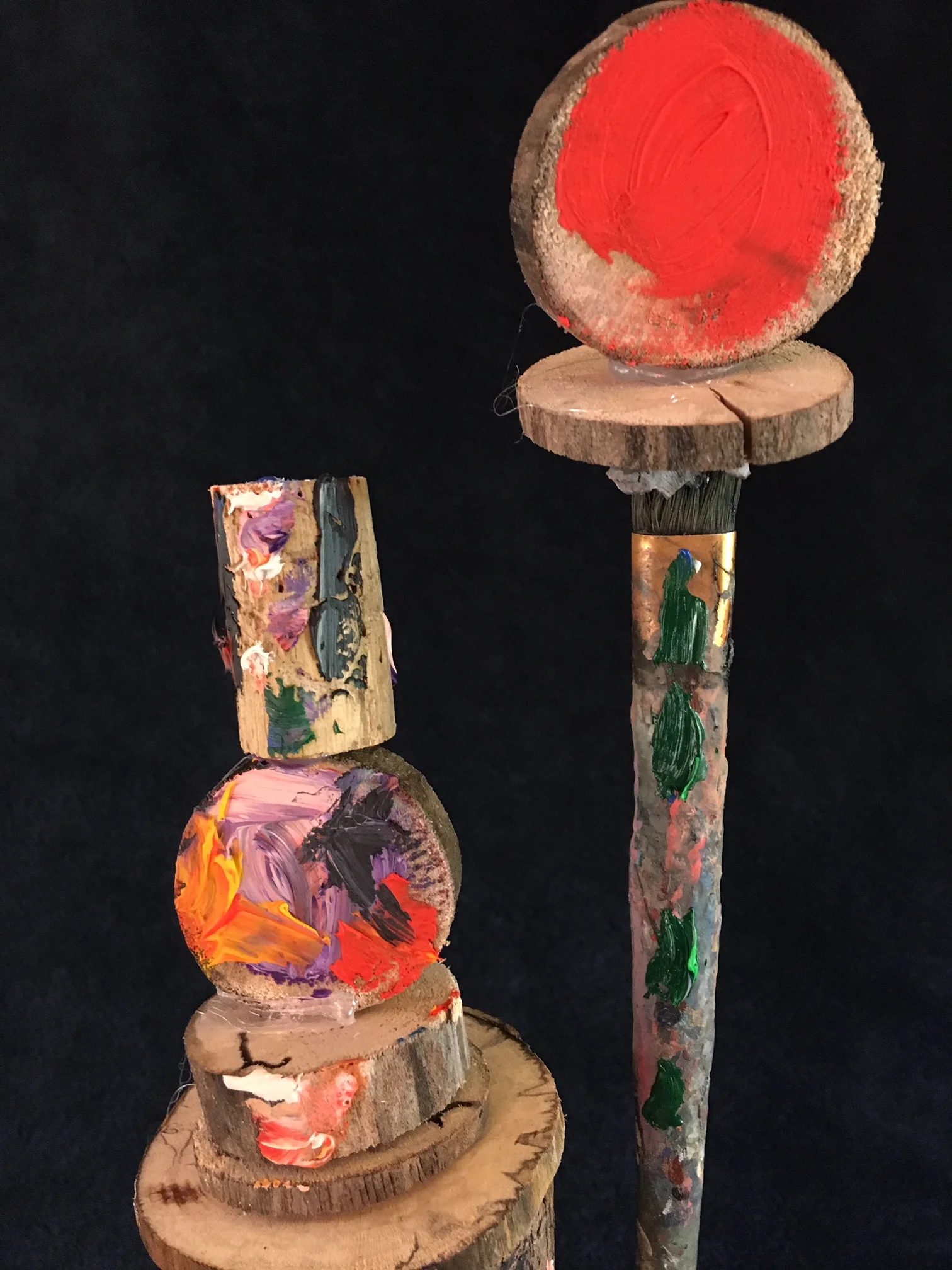 oil paint, paintbrush and wood sculpture on wooden base