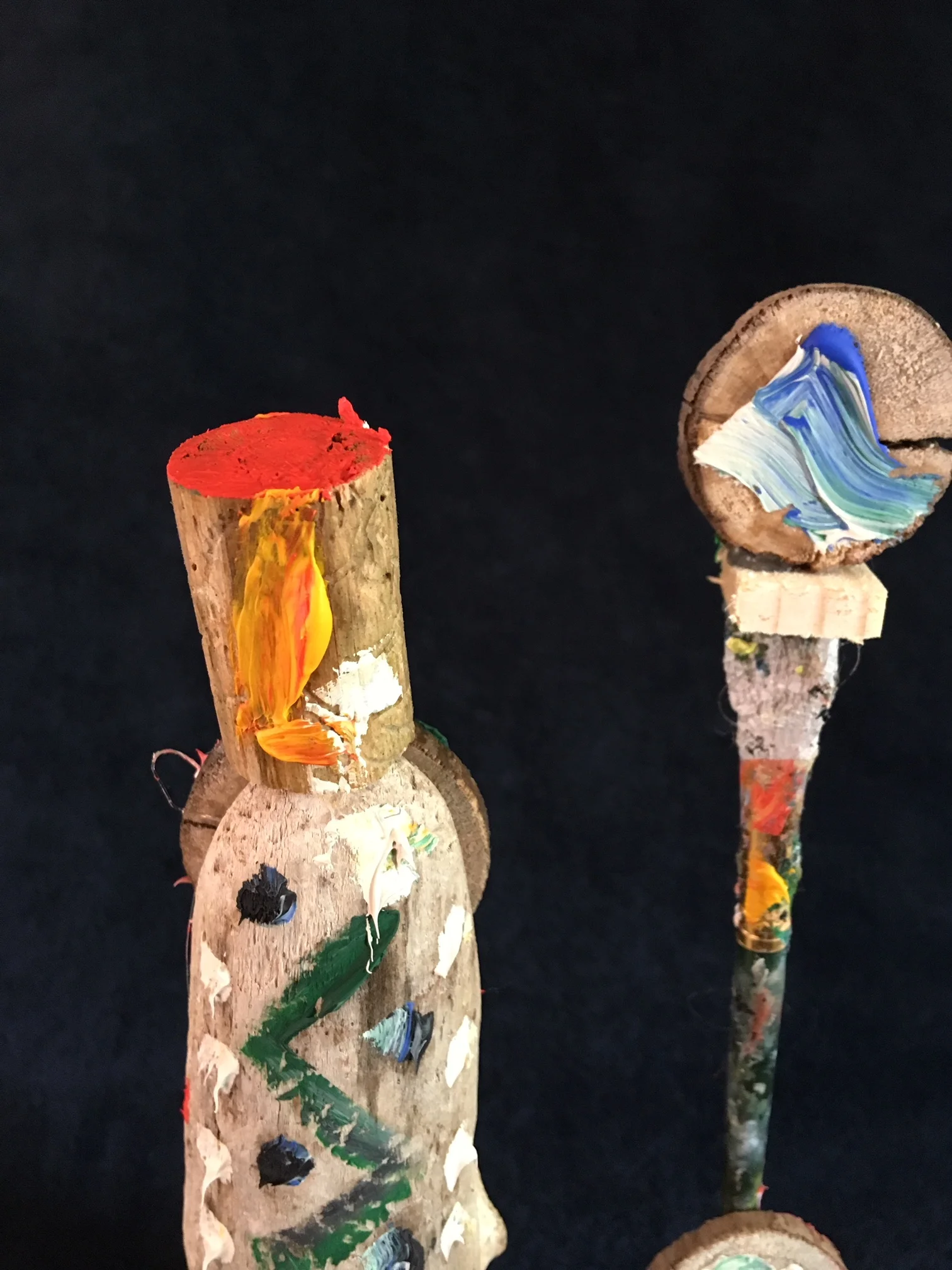 oil paint, paintbrush and wood sculpture on wooden base