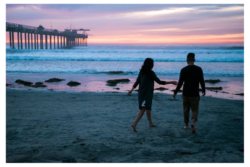 La Jolla couple walking down the pier