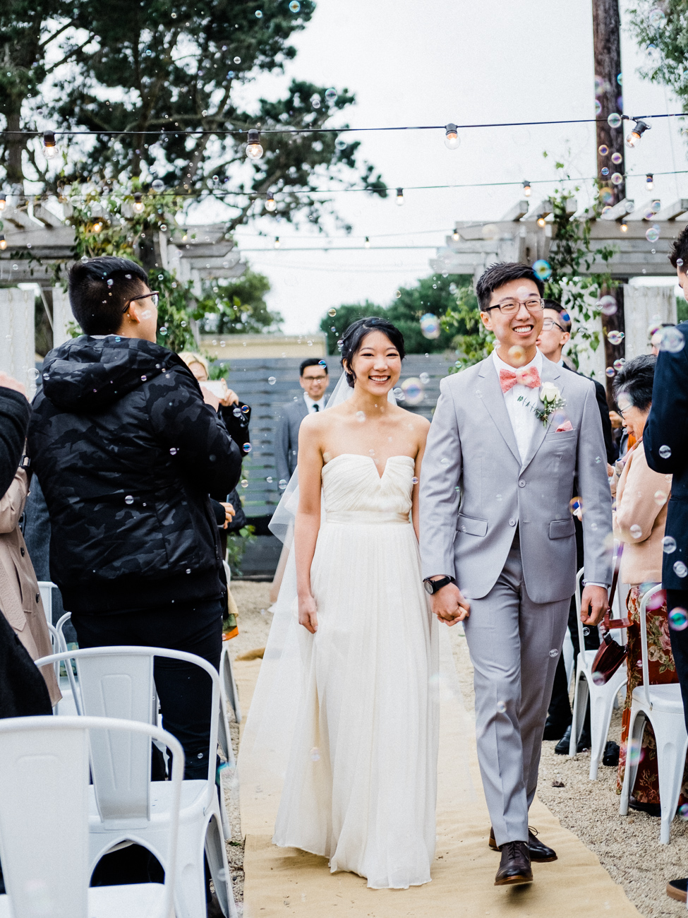 ceremony at aracely cafe bride and groom with bubbles