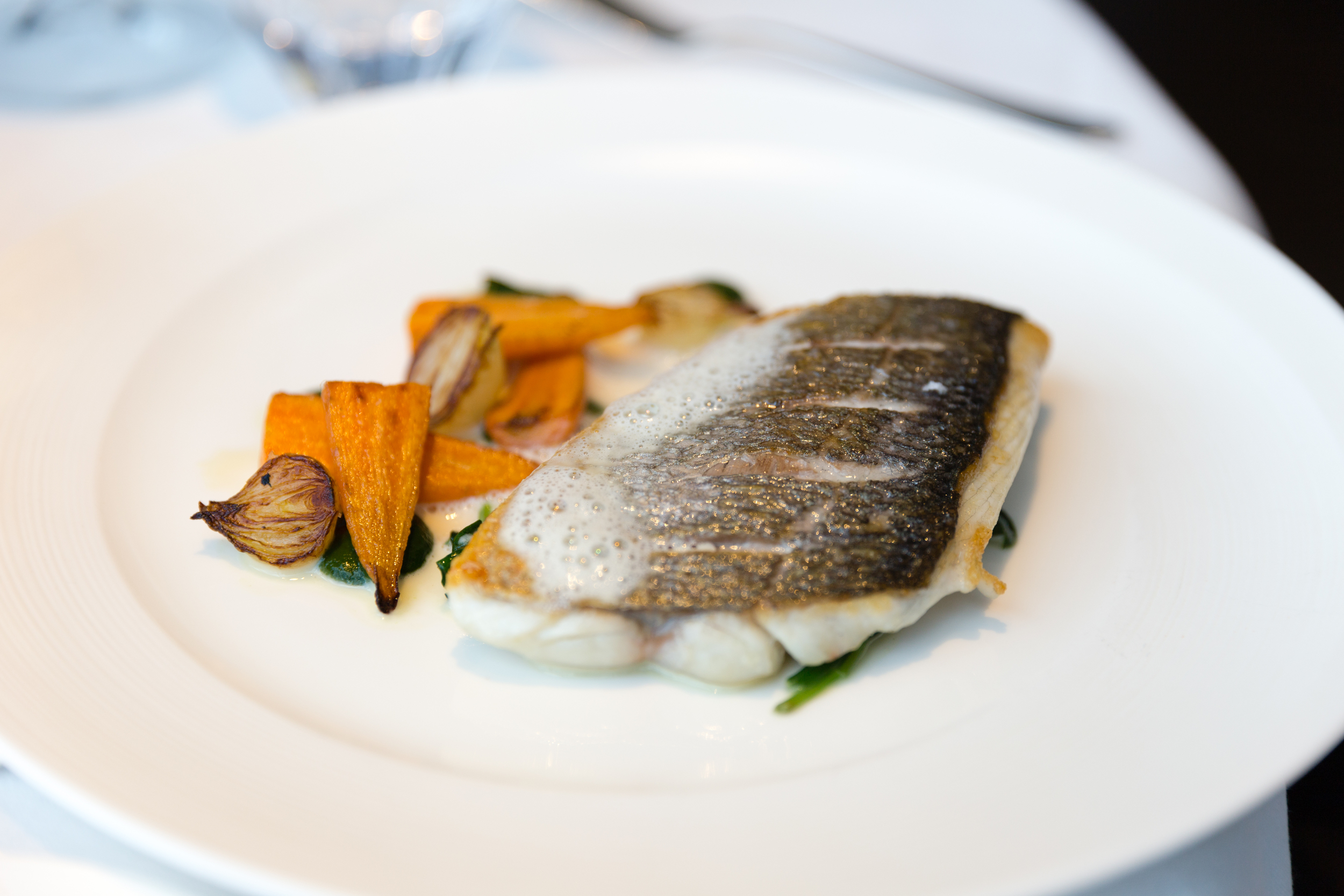 Sea Bass - Root vegetable ragout, edamame beans, yuzu butter emulsion