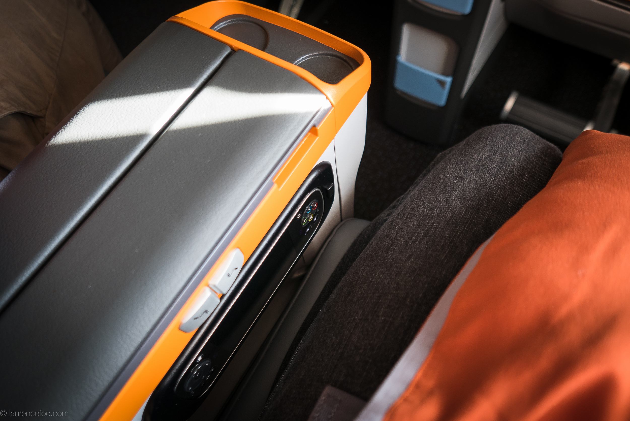 The meal trays are located in the arm rests rather than in the seat in front of you