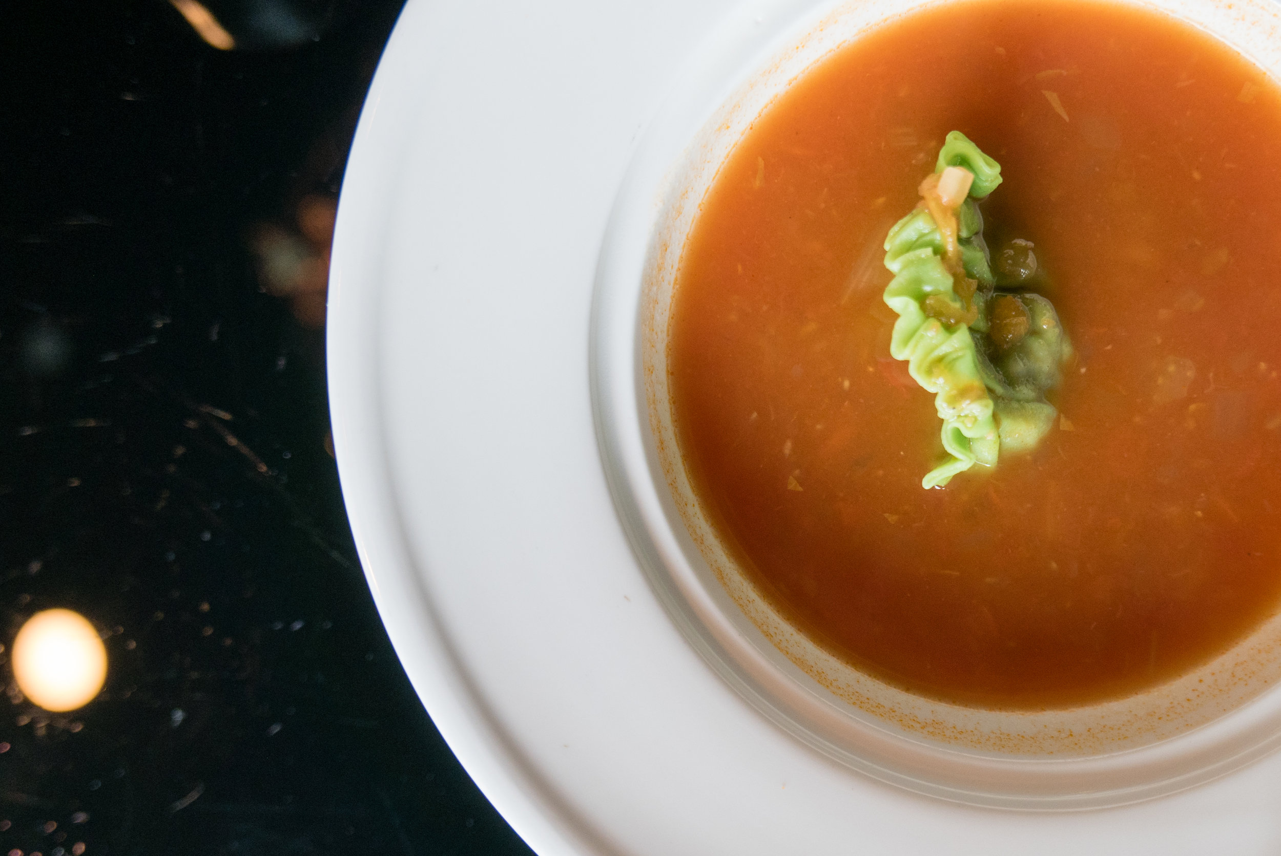 Clear Tomato soup with Garbanzo - tomato broth with orzo pasta and garbanzo served with spinach dumpling