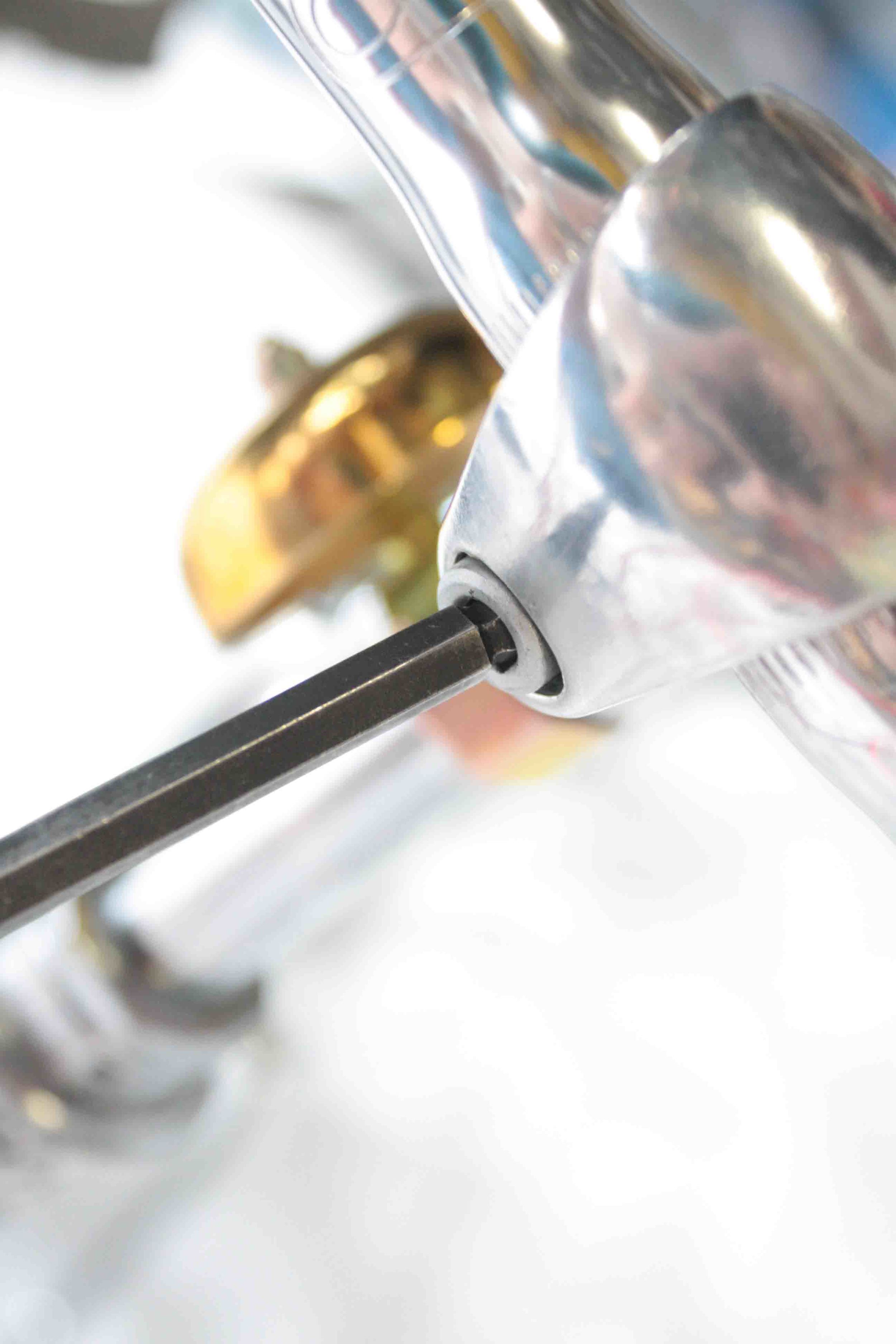 Using the 6mm allen tool, tighten the head bolt that holds the handlebar so that the grips have a slight downward tilt.