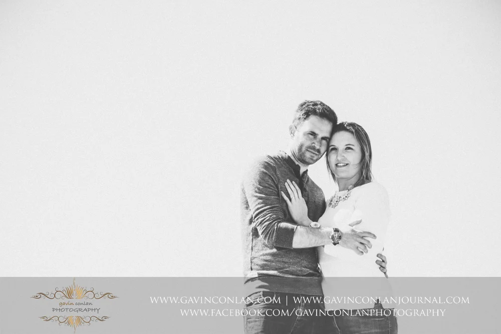 black and white portrait of Victoria and James at Old Harry Rocks . Engagement Session in Bournemouth, Dorset by gavin conlan photography Ltd