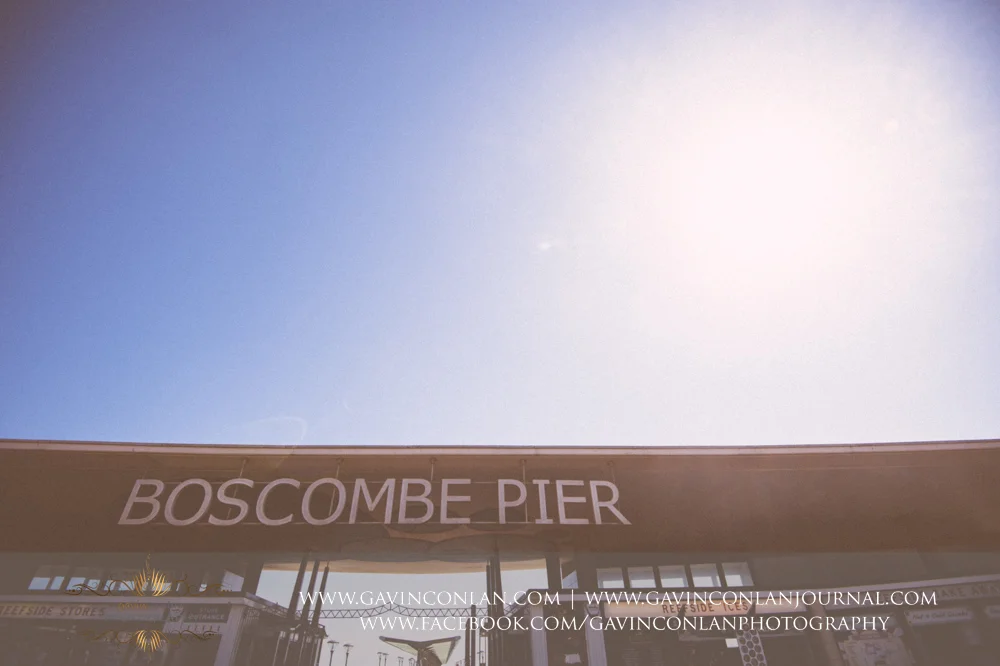 Boscombe Pier sign. Victoria and James Engagement Session in Bournemouth, Dorset by gavin conlan photography Ltd