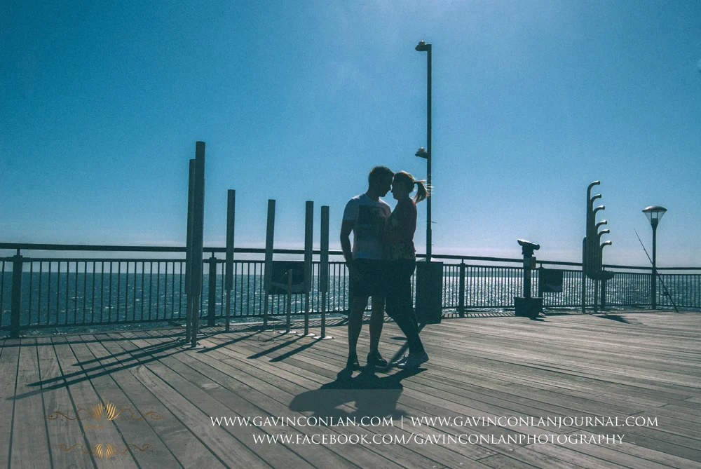 creative abstract portrait of Victoria and James on Boscombe Pier . Engagement Session in Bournemouth, Dorset by gavin conlan photography Ltd