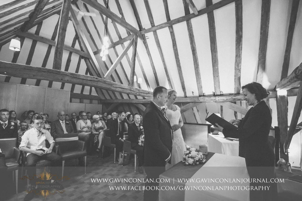creative black and white wedding ceremony photograph. Wedding photography at The Barn Brasserie by Essex wedding photographer gavin conlan photography Ltd