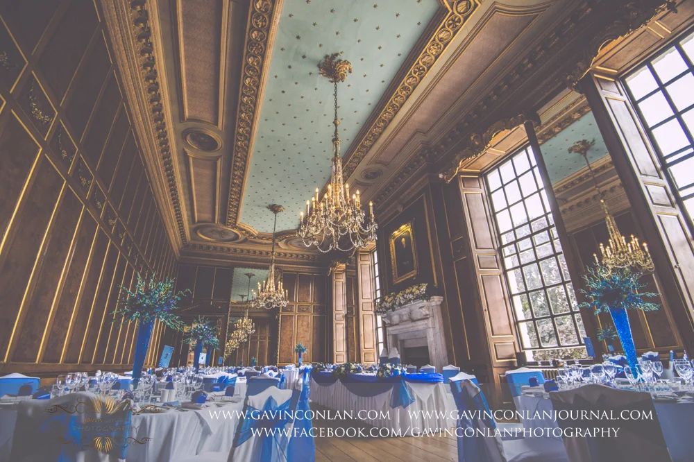 beautiful interior photograph of the ballroom all set up for Lisa and Rob's wedding breakfast. Wedding photography at Gosfield Hall by Essex wedding photographer gavin conlan photography Ltd