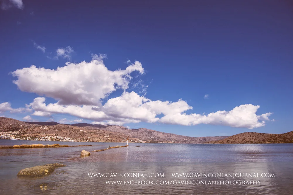 The wedding party taking an art lesson by Visual Arts Crete and showcasing their artisic talent in Crete, Greece by gavin conlan photography Ltd